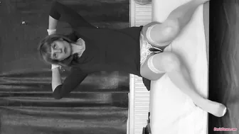 Doris Dawn busty  cam girl  caresses her lips.