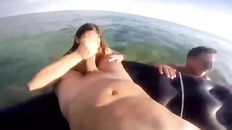 Fingering cock on the beach