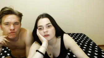 lustful_trio busty  cam girl  caresses her lips.