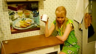 a guy fucks a girl in the kitchen in a hostel