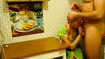 a guy fucks a girl in the kitchen in a hostel