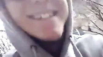 A young couple scampering on a bench