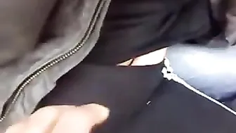 A young couple scampering on a bench