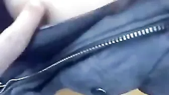 A young couple scampering on a bench