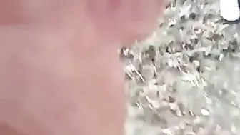 A young couple scampering on a bench