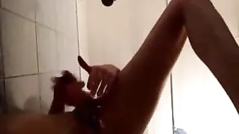Caresses herself in the shower