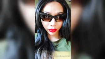 Long Mint pretty woman sitting in a chair