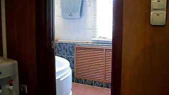 girl caresses her crotch in the bathroom
