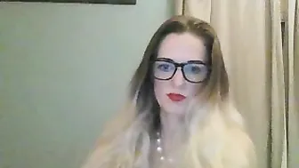 Fucks herself in the pussy with a toy