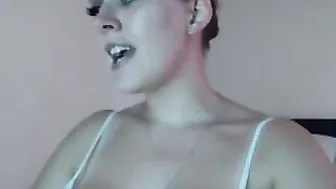 tabby Busty female pleases herself with sex toy